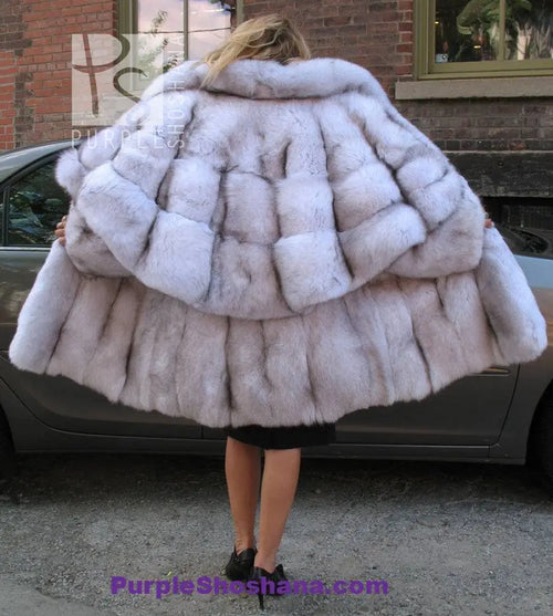Plush light fur hooded coat with structured shoulder cape and quilted panel look
