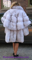 Plush light fur hooded cape-style coat with voluminous collar and back panel