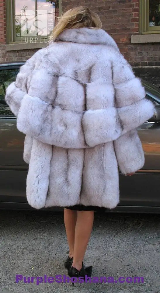 Plush light fur hooded cape-style coat with voluminous collar and back panel