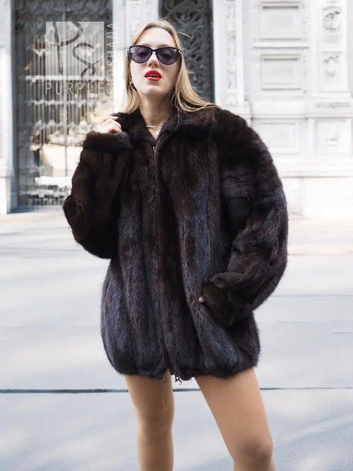 Unisex mink fur bomber jacket, dark plush texture with zip-front and stand collar.