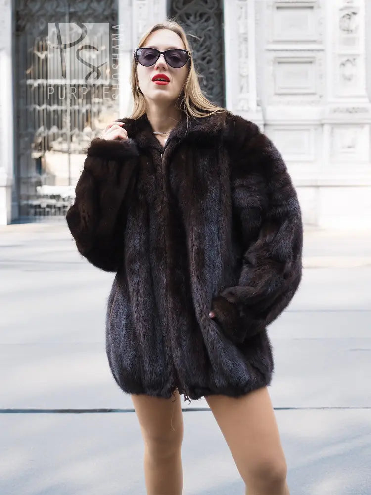 Unisex mink fur bomber jacket, dark plush texture with zip-front and stand collar.