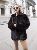 Unisex mink fur bomber jacket with zip closure, dark fur texture and stand collar.