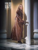 Mahogany brown mink fur coat with full-length silhouette and textured fur panels, side view.