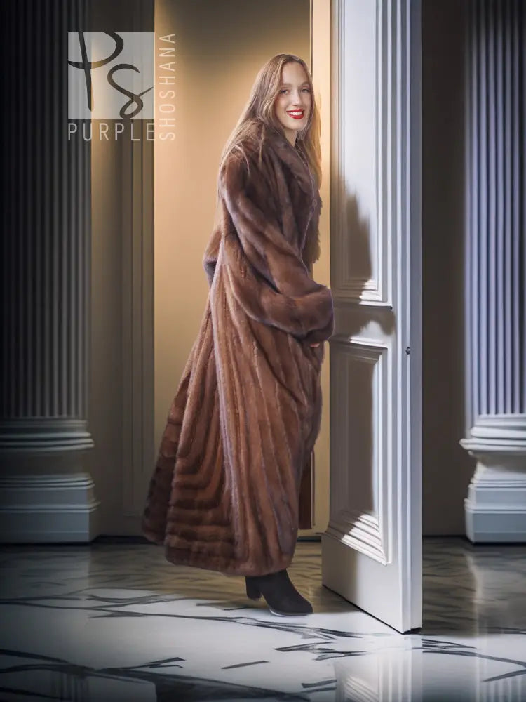 Mahogany brown mink fur coat with full-length silhouette and textured fur panels, side view.