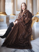 Mahogany brown mink fur coat with shawl collar and wide draped hem, front view.