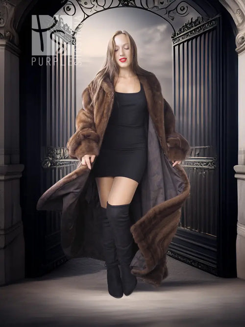 Mahogany mink fur coat with open front and stand collar over a black slip dress