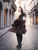 Dark brown mink fur coat with wide collar and flared hem, walking pose
