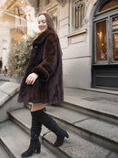 Mink fur coat with rounded cuffs, dark brown shawl collar and flared hem