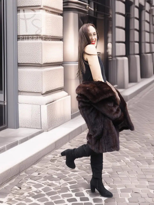 Dark brown mink fur coat with wide collar and layered sleeves, walking away view