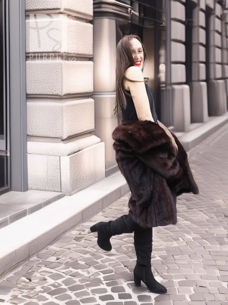 Dark brown mink fur coat with wide collar and layered sleeves, walking away view