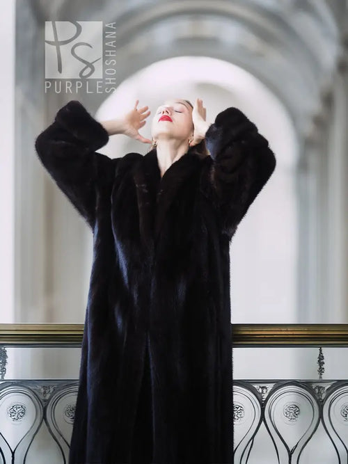 Black mink fur coat with raised arms, long silhouette