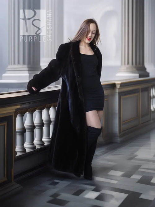 Black mink fur coat draped open at front, long length
