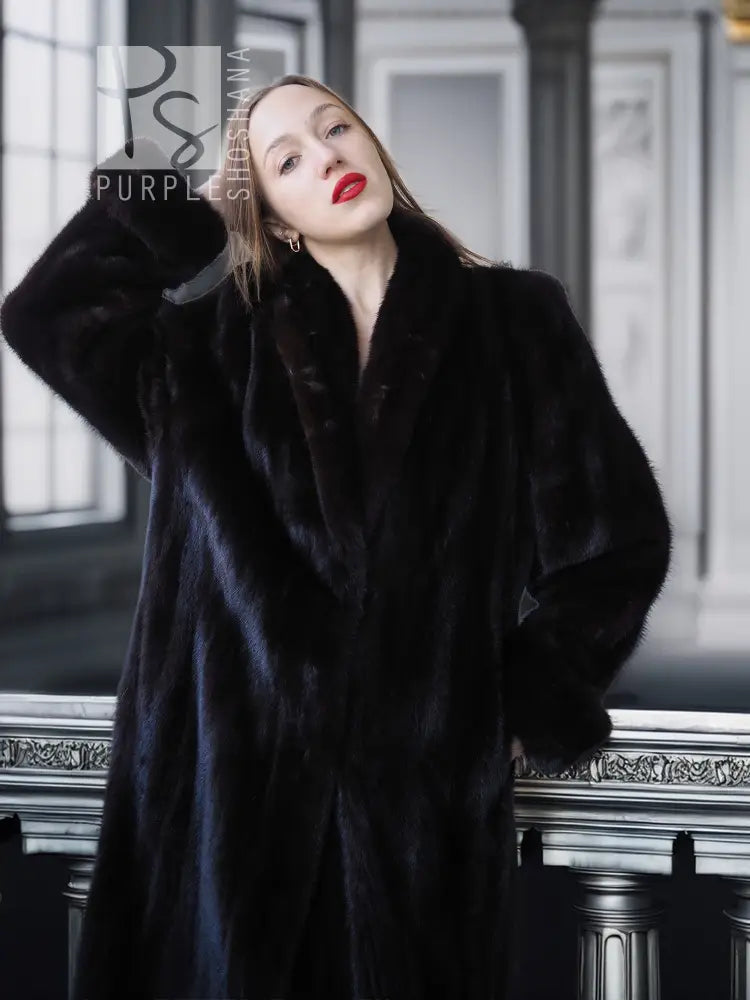 Dark mink fur coat with fold-back cuffs, open collar detail and long sleeves