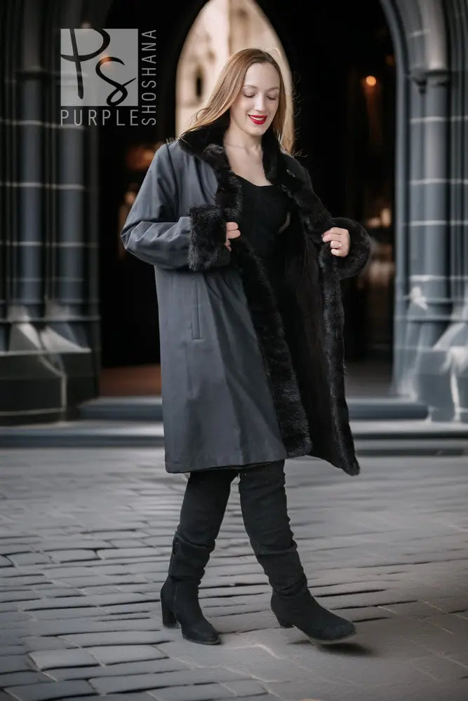 Dark mink coat with wide turn-back collar, button details, and short sleeves