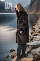 Dark fur button-front coat with plush cuffs, knee-length, side view