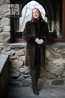 Dark sheared mink coat with button closure and plush fur cuffs, long length