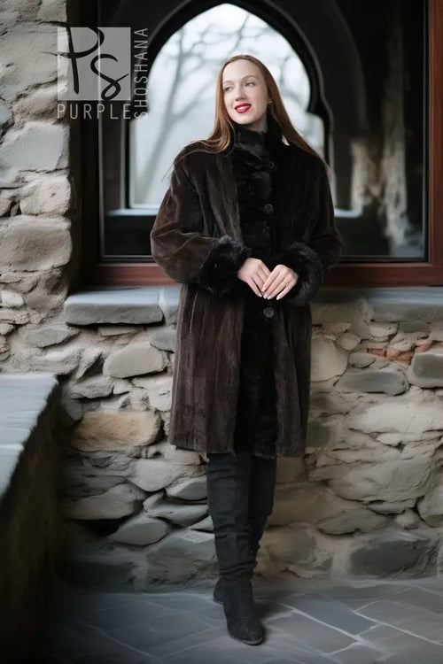Dark sheared mink coat with button closure and plush fur cuffs, long length