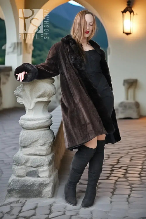 Dark mink coat with fur collar, button front, and wide sheared panels at sides