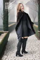 Black mink coat with full button front, oversized collar, and flared hem