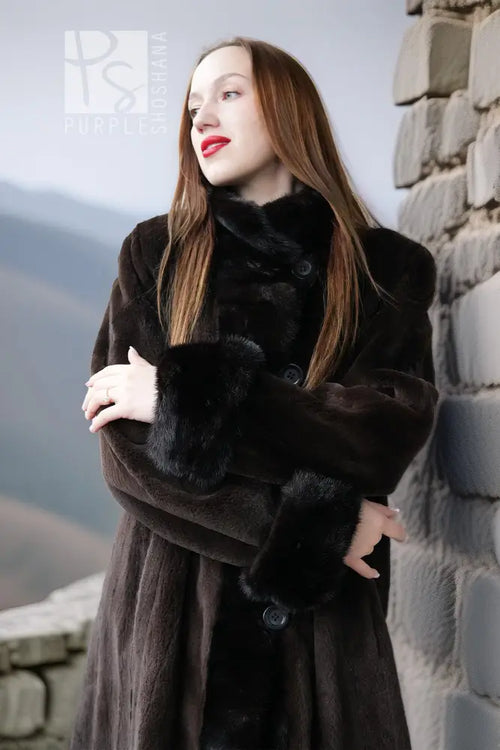 Front view of dark mink coat with oversized collar and button placket