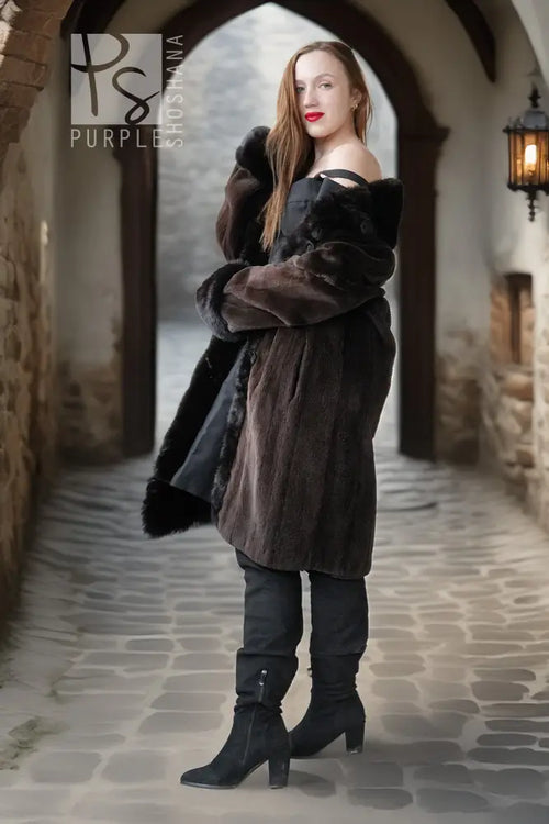 Long dark mink coat with fur hood/collar, button front, and plush fur-trimmed sleeves