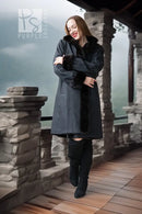 Dark mink coat with front button placket and full fur collar, worn over dark outfit