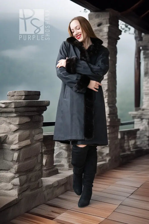 Dark mink coat with front button placket and full fur collar, worn over dark outfit