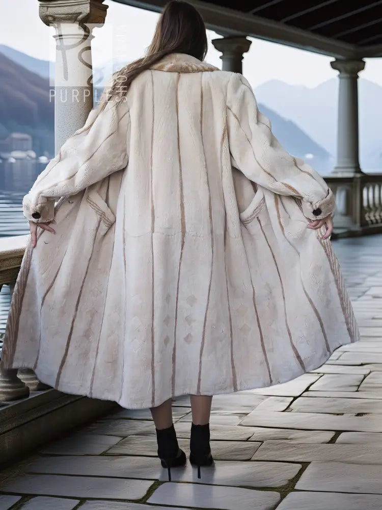 Back view of cream sheared beaver fur coat with gathered back yoke and flared hem