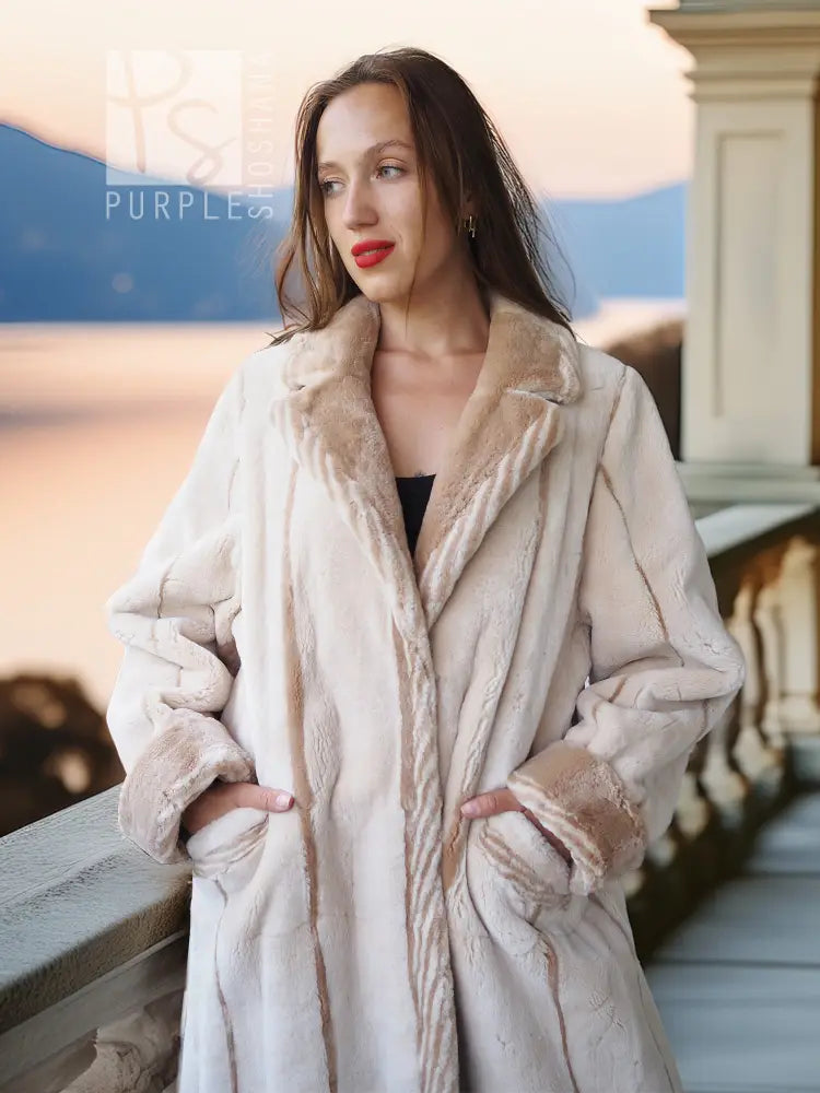 Cream beaver fur coat with open front, plush shawl collar, and textured sleeves.