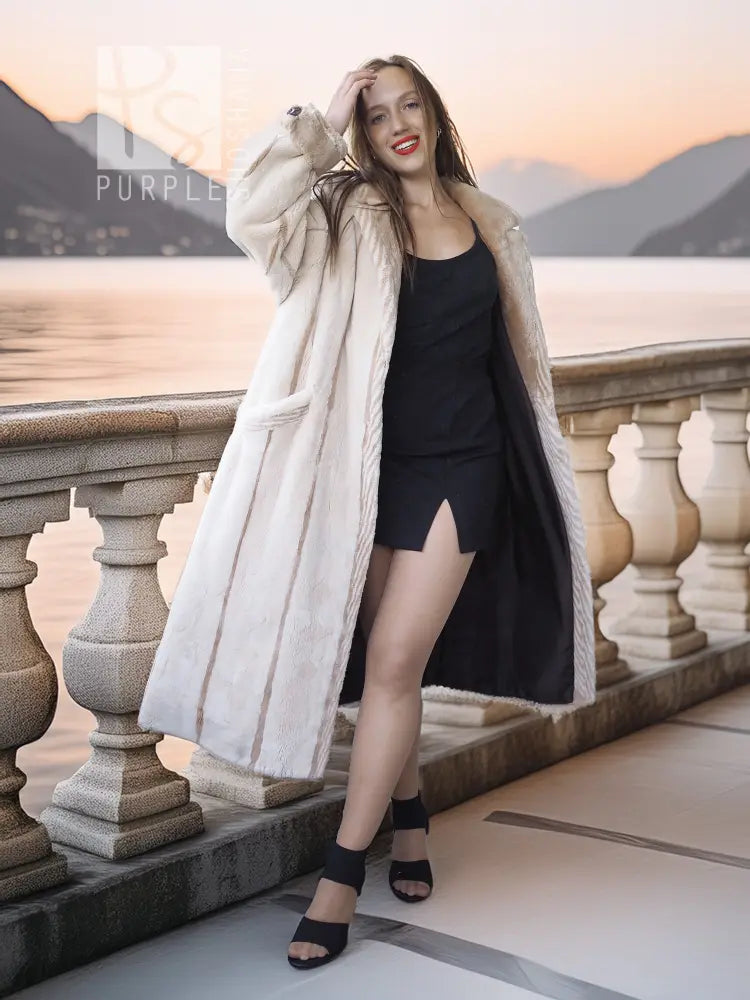 Cream beaver fur coat, long open front with vertical shear texture.