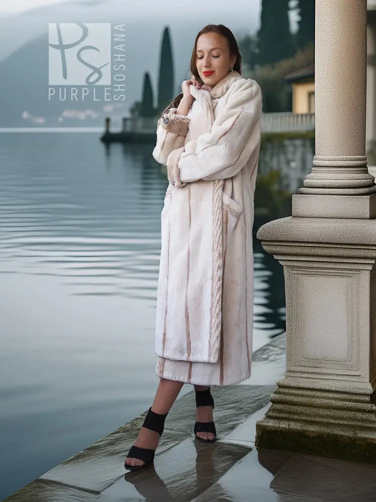 Cream beaver fur coat with open front, plush collar, and long sleeves; mid-calf.