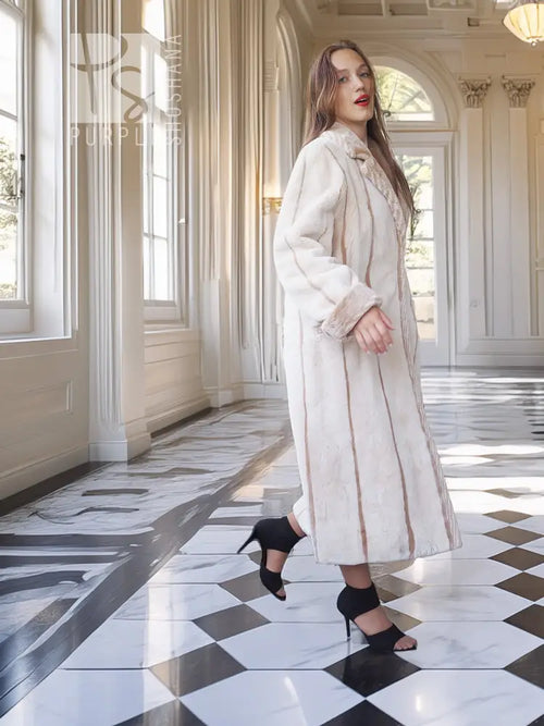 Cream beaver fur coat with notched collar, belted waist detail, and long sleeves