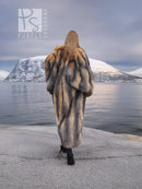 Back view of long gray and amber fox fur coat with full, flowing silhouette.