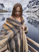 Gray and amber fox fur coat close-up across shoulders, V-neck style opening.