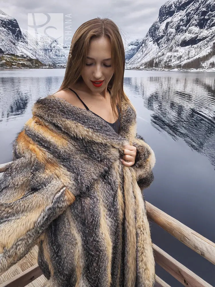Gray and amber fox fur coat close-up across shoulders, V-neck style opening.