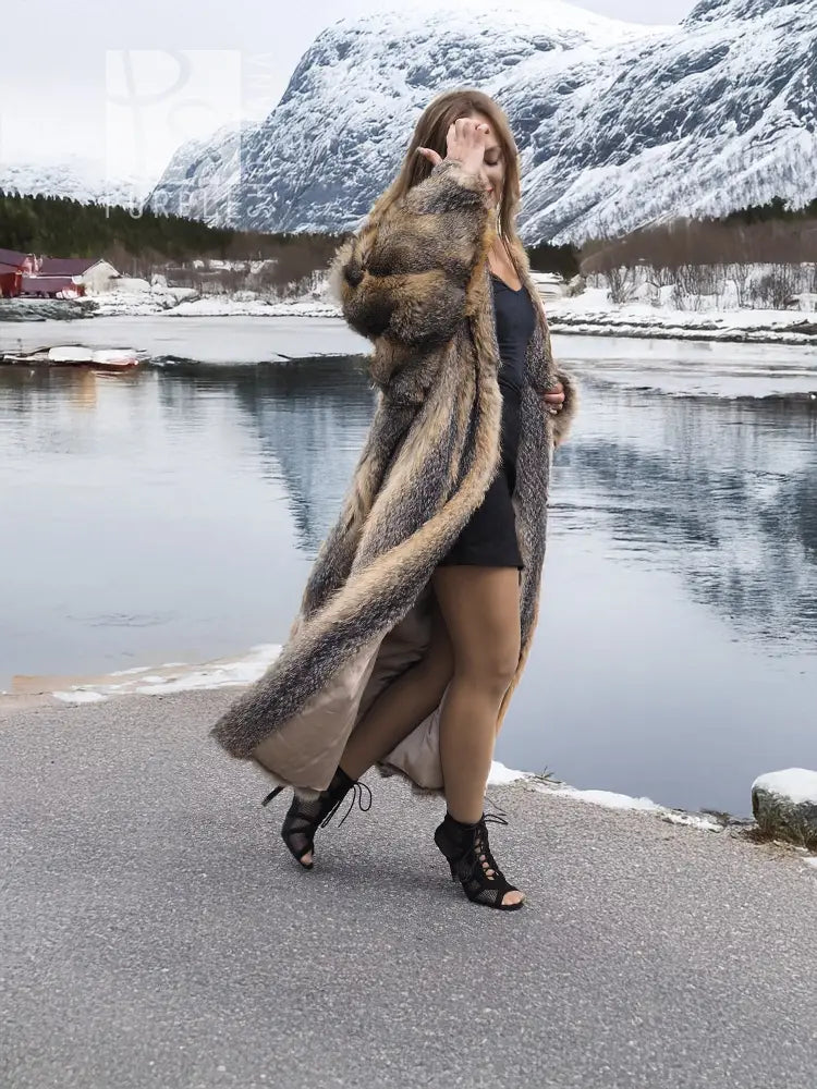 Vintage fox fur coat with hooded collar, long gray and tan striped texture.
