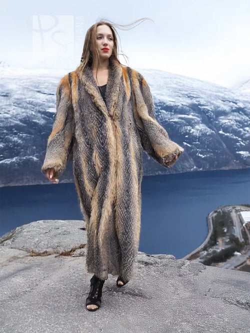 Gray and amber fox fur coat with deep V neckline, long sleeves and ankle length.