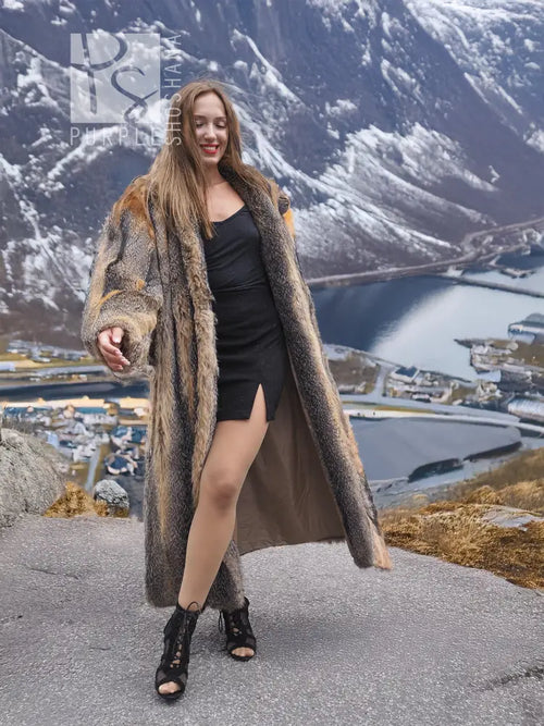 Long gray and amber fox fur coat with open front and slit hem, ankle length.