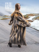 Vintage fox fur coat in gray and tan, long silhouette with plush hooded collar.