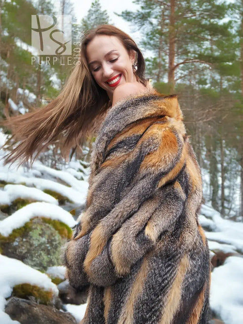 Close-up of gray and amber fox fur coat shoulder and collar, soft textured pattern.