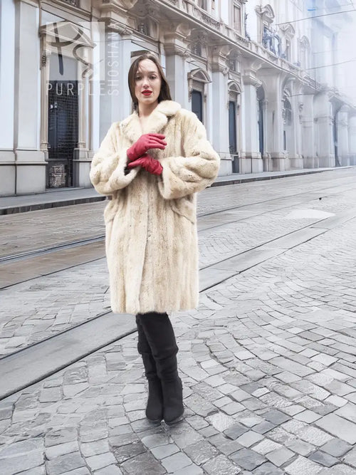 Beige mink fur coat with straight front and long sleeves