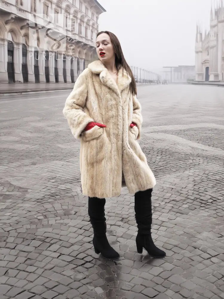 Vintage beige mink fur coat with textured fur body, long sleeves and flared hem