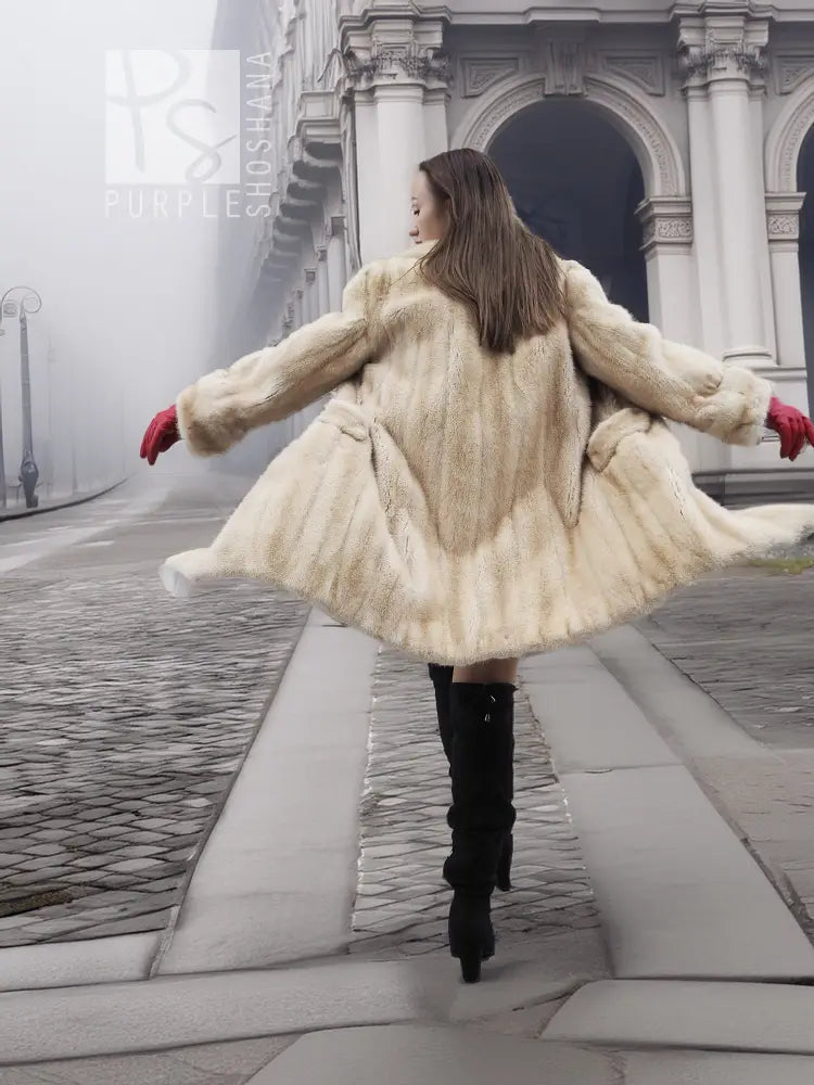 Beige mink fur coat with voluminous flared hem and long sleeves