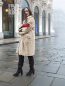 Vintage beige mink fur coat close-up of textured beige fur with wide collar