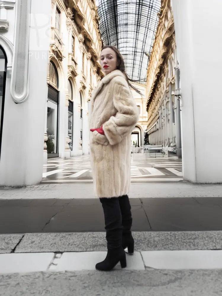 Beige mink fur coat with plush fur collar and tapered sleeve openings