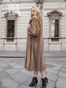Brown mink fur coat with hood, full front view, long sleeves, midi length.