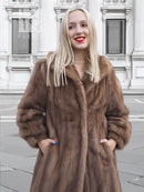 Brown mink fur coat front view with shaggy texture and pointed fur collar