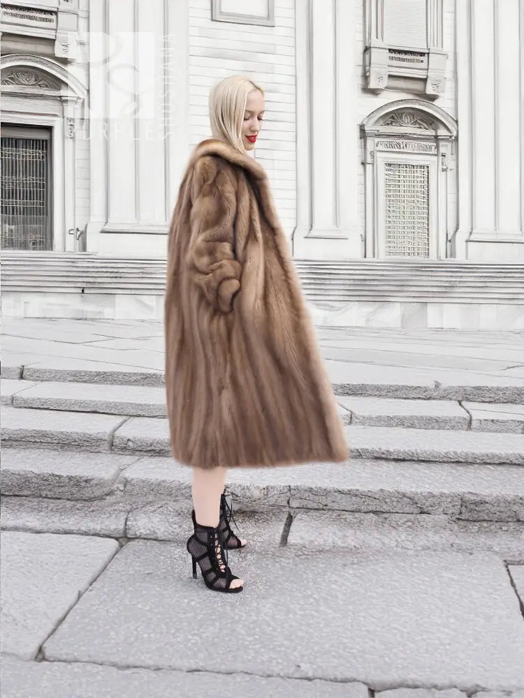 Brown mink fur coat with long straight silhouette and plush fur collar, side view