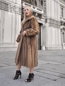 Brown mink fur coat with full sleeves and long length, buttoned front, fur collar
