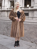 Brown mink fur coat with hood, open front styling, long sleeves, midi length.
